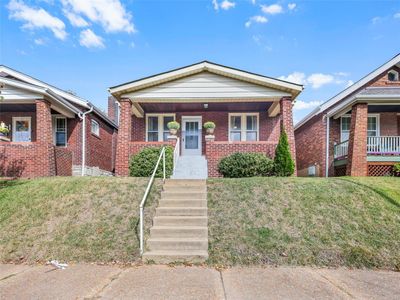 Bungalow-style house featuring a porch | Image 1