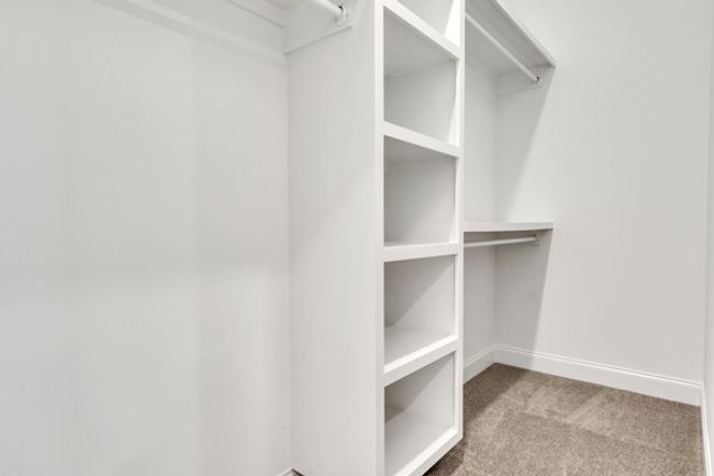 Custom closet provides plenty of room for owner's belongings. | Image 34