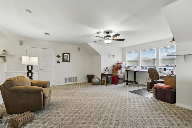 Upstairs Office area featuring a ceiling fan, lofted ceiling, and carpet | Image 29