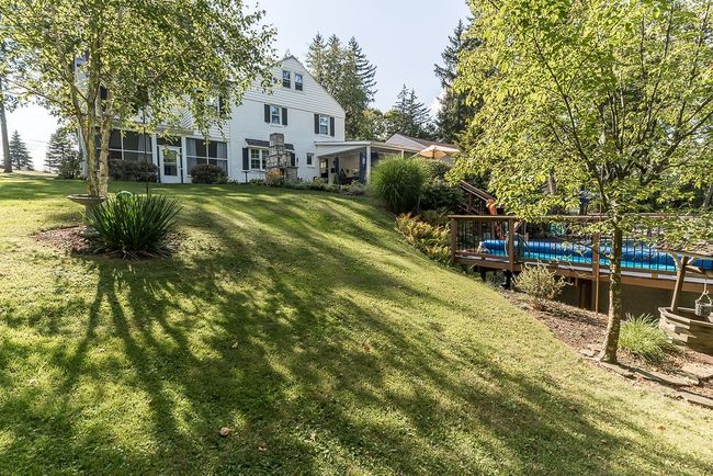 steps from the patio to the pool deck make it easy! | Image 21
