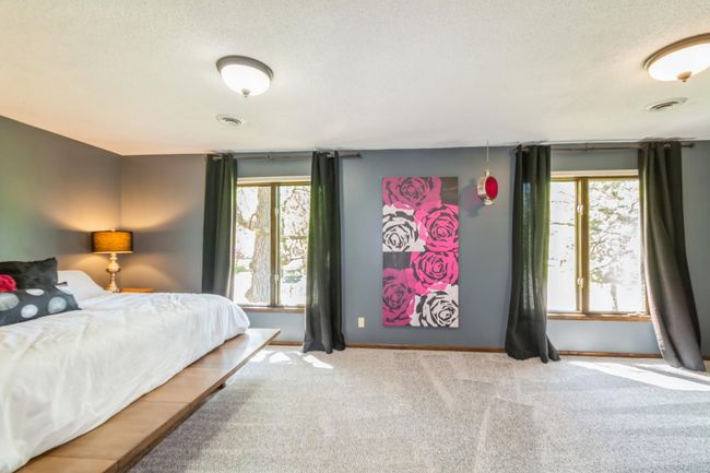 Large primary bedroom includes a private sitting area, large walk in closet and a 3/4 bathroom! This room also has brand new carpet. | Image 27