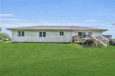 Rear view of property with a wooden deck and a yard | Image 2