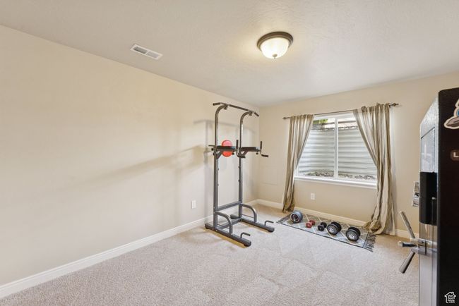 Workout area featuring carpet and baseboards | Image 32