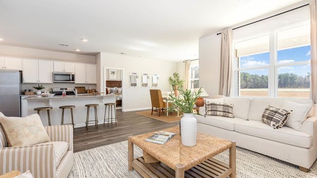 Living area with recessed lighting, baseboards, visible vents, and wood finished floors | Image 9