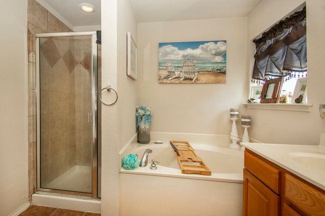 Full bath with vanity, a shower stall, and a garden tub | Image 19