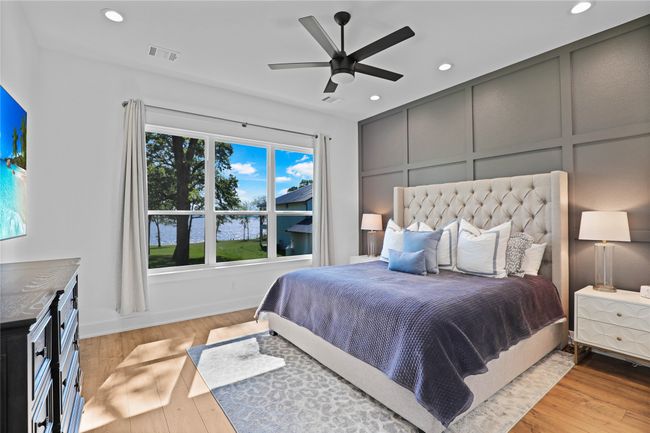 Bedroom with recessed lighting, light wood-type flooring, visible vents, and baseboards | Image 16