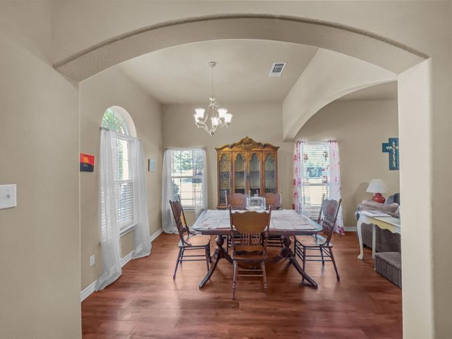 Dining room across from office & open to living room | Image 6