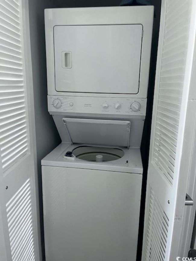 Laundry area featuring stacked washer / dryer | Image 16