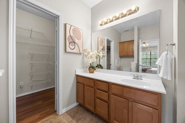 Bathroom featuring vanity and a spacious closet | Image 24