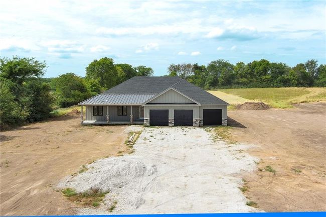 View of front of home featuring an outbuilding and a garage | Image 24
