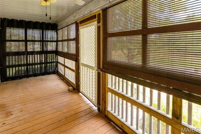 View of unfurnished sunroom | Image 12