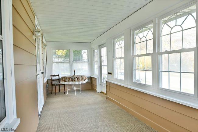 Sunroom featuring plenty of natural light | Image 5