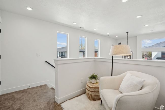 Sitting room featuring recessed lighting, an upstairs landing, and a healthy amount of sunlight | Image 15