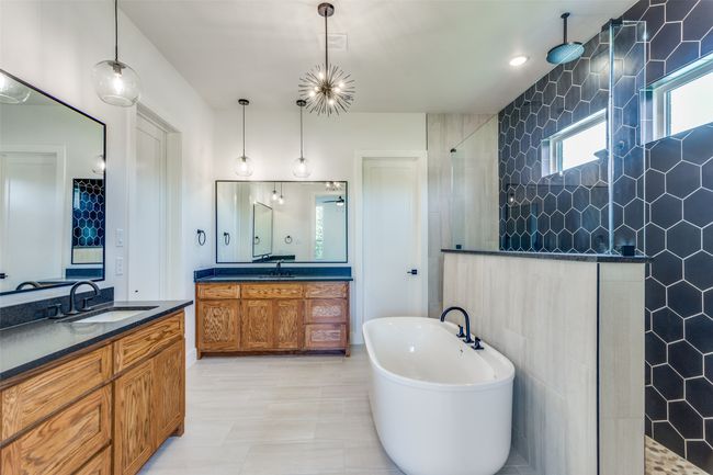 Bathroom with a sink, walk in shower, two vanities, and a soaking tub | Image 15