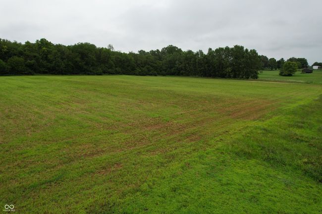 view of green lawn featuring a forest view | Image 13