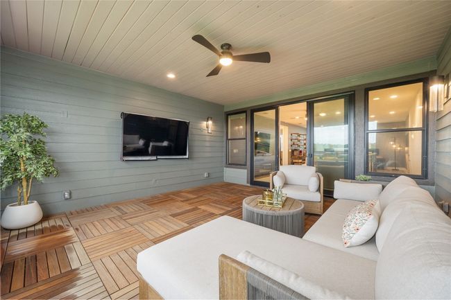 View from outdoor living room looking towards the family room. | Image 19