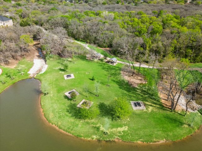 Drone / aerial view with a wooded view and a water view | Image 24