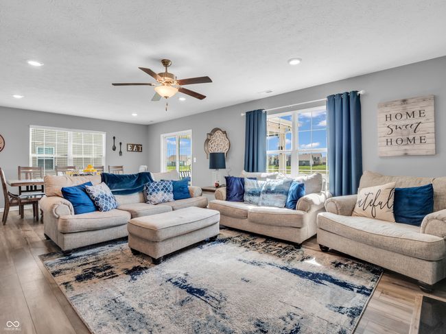 living room with ceiling fan, recessed lighting, and vinyl plank flooring | Image 13