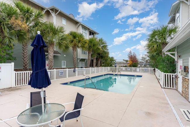 Community pool with a patio | Image 35