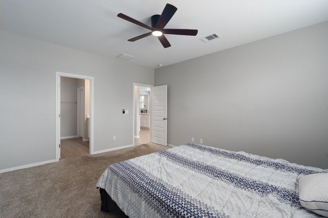 Carpeted bedroom featuring baseboards and a ceiling fan | Image 12