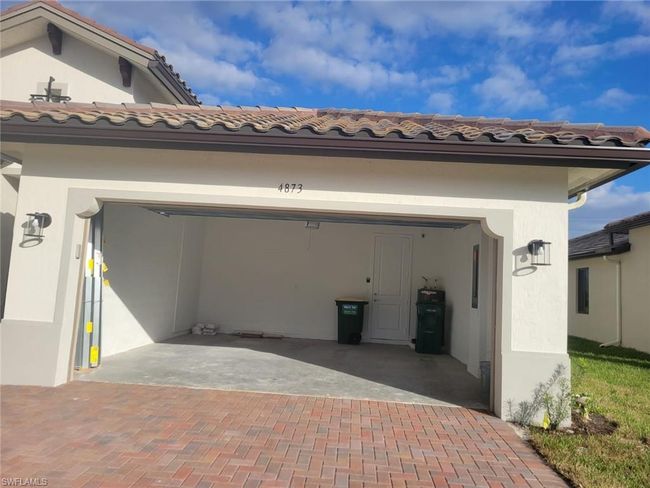 Garage with decorative driveway | Image 35