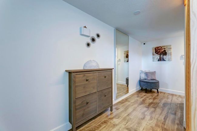 Hallway featuring baseboards and light wood-style floors | Image 18
