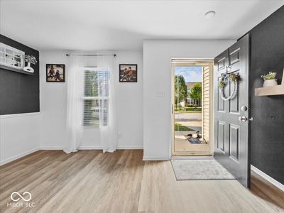 Entry foyer opens to family room | Image 2