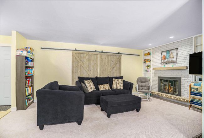 LIVING ROOM - FIREPLACE - SLIDING BARN DOOR STYLE WINDOW COVERING | Image 6