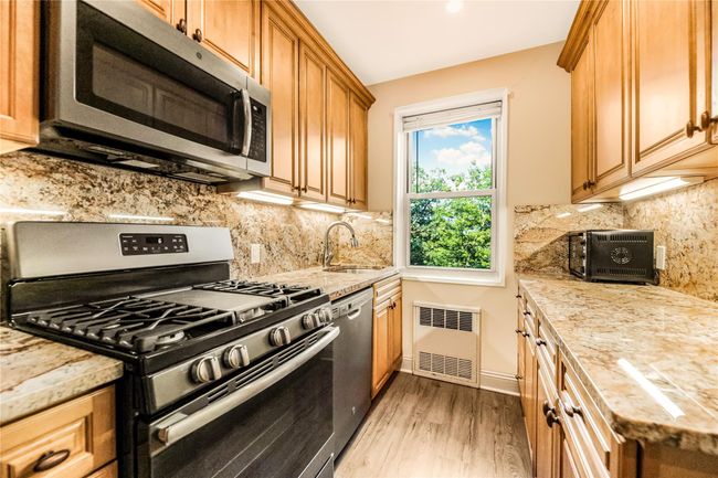 Unfurnished room with light wood finished floors and baseboards | Image 11
