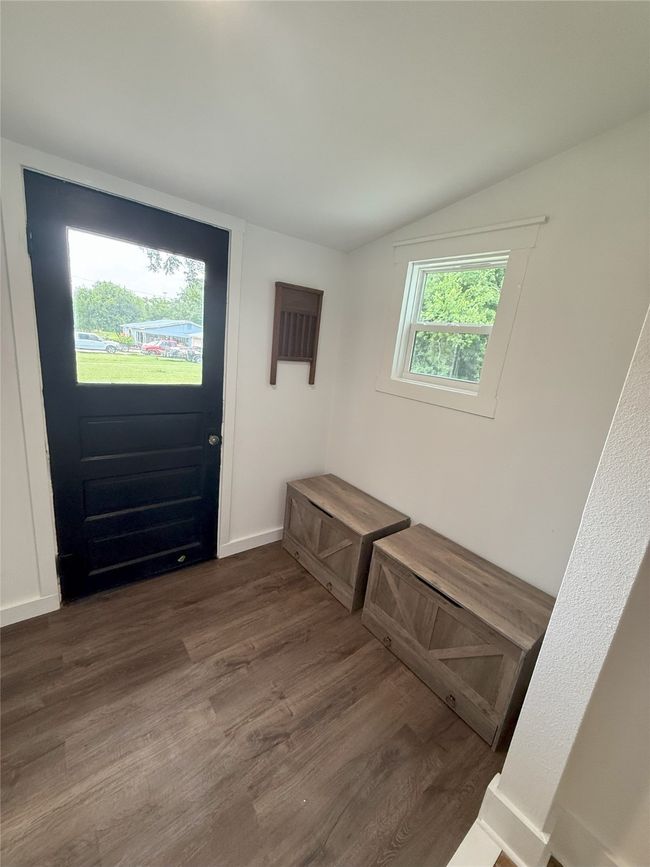 Mudroom featuring wood finished floors and lofted ceiling | Image 13