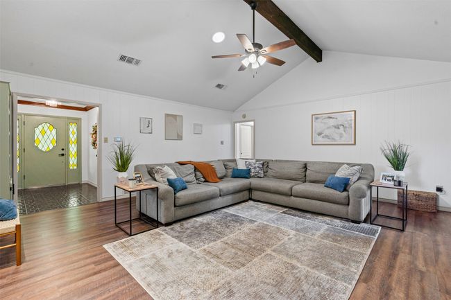 Living room featuring wood finished floors and a ceiling fan | Image 7