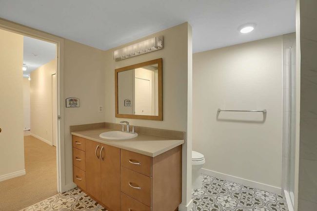 Bathroom with vanity and tile patterned flooring | Image 25