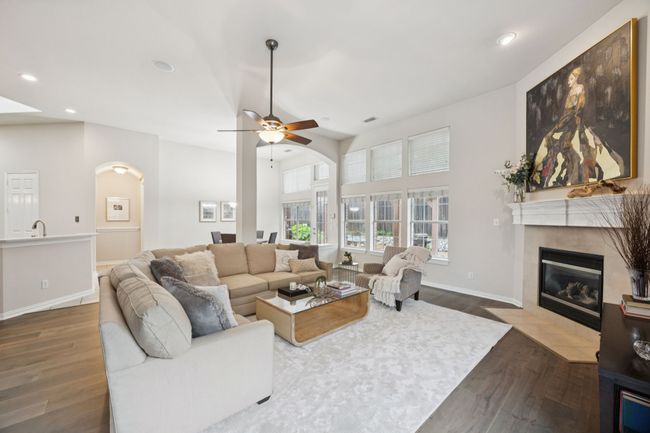 This expansive living space connects effortlessly to the kitchen and dining areas, making it easy to gather, relax, or entertain—all while enjoying views of the backyard. | Image 12