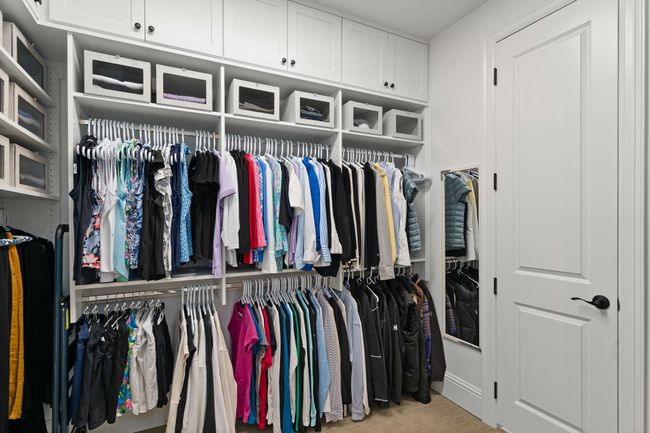 View of spacious custom closet. | Image 23