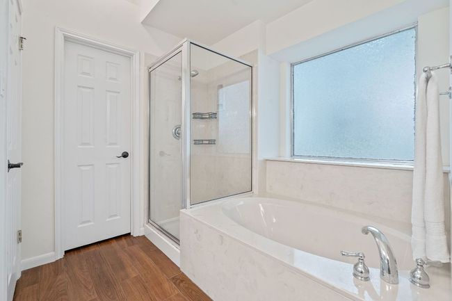 Soak away the day's stress in the relaxing garden tub and enjoy a separate walk-in shower. | Image 23