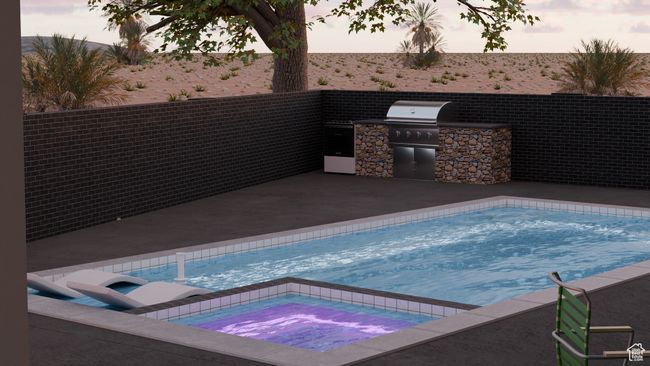 View of swimming pool featuring a grill, exterior kitchen, and an in ground hot tub | Image 6