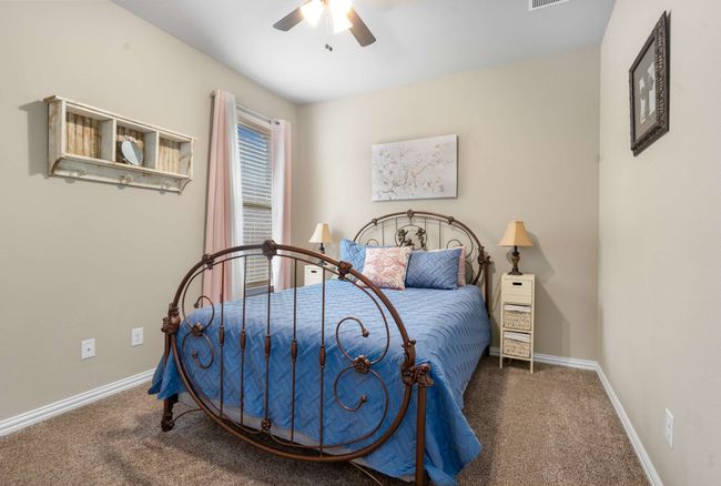 Carpeted bedroom featuring baseboards and a ceiling fan | Image 15