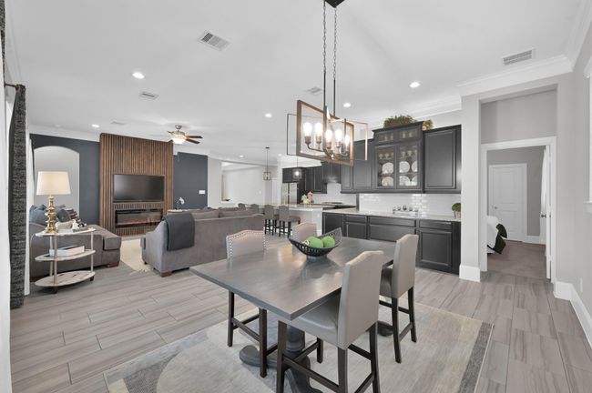 Breakfast area opens to kitchen and family room. Built in cabinets for added storage | Image 11