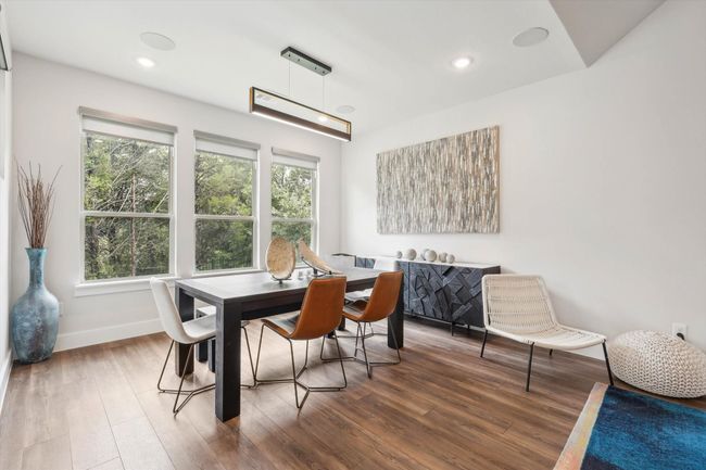 Dining area with the view of serene wooded space! | Image 9