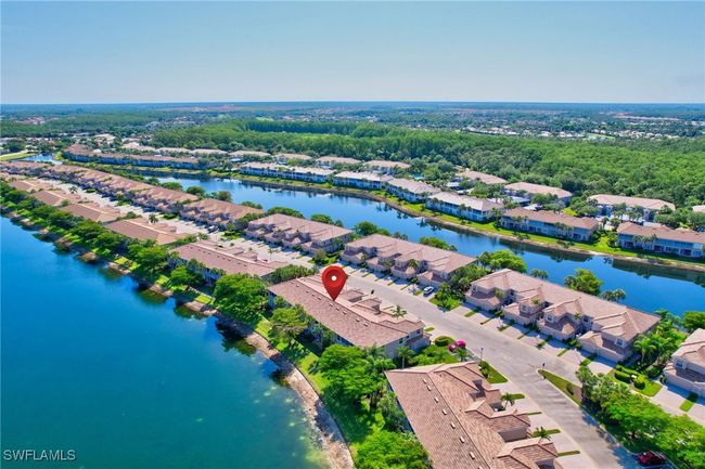 Aerial view of residential area with a large body of water | Image 43