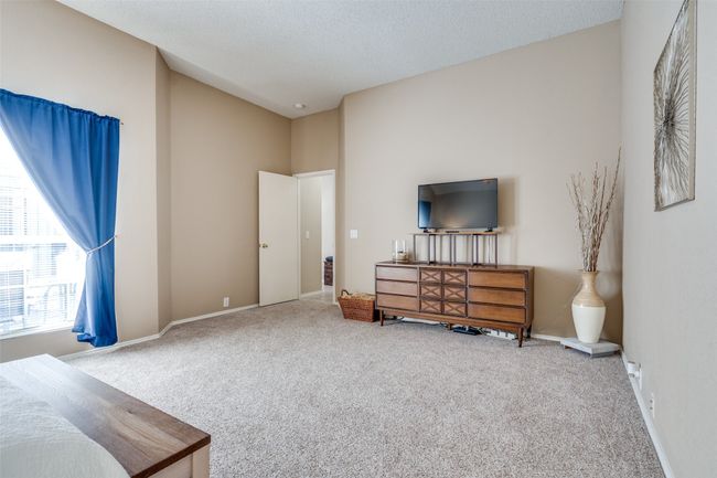 There is ample room for a seating area in the large primary bedroom. | Image 17