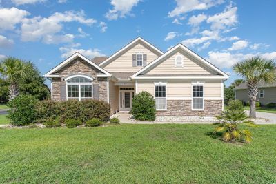 View of front facade with a front lawn | Image 1