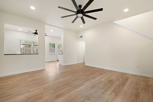 Unfurnished living room featuring ceiling fan, recessed lighting, and light wood finished floors | Image 8
