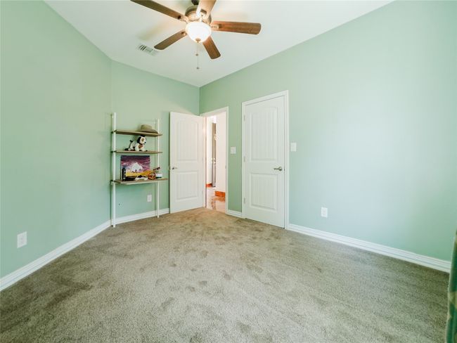 Unfurnished bedroom featuring carpet flooring and a ceiling fan | Image 28