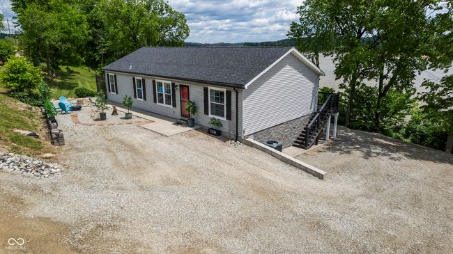 view of front of home with roof with shingles and stairway | Image 78
