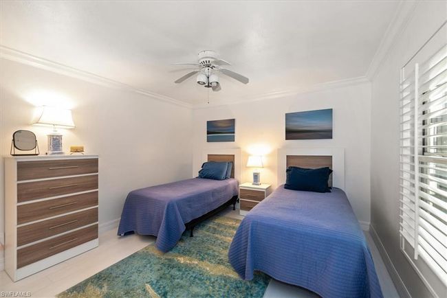 Bedroom with crown molding and a ceiling fan | Image 20
