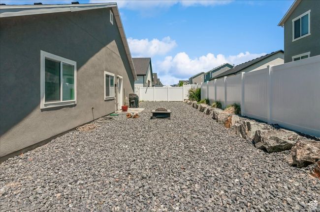 Fenced backyard with a residential view | Image 29