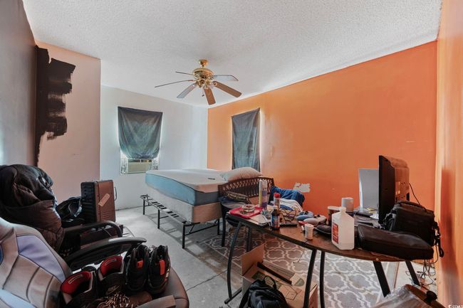Bonus Room with a ceiling fan, concrete floors, and a textured ceiling | Image 15