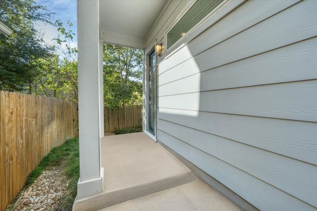The exterior has a covered patio! | Image 16