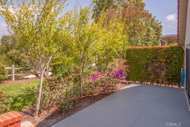 Rear patio is perfect for larger-scale outdoor entertaining or dining. | Image 29